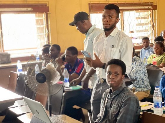 Students at a meeting in a lecture room